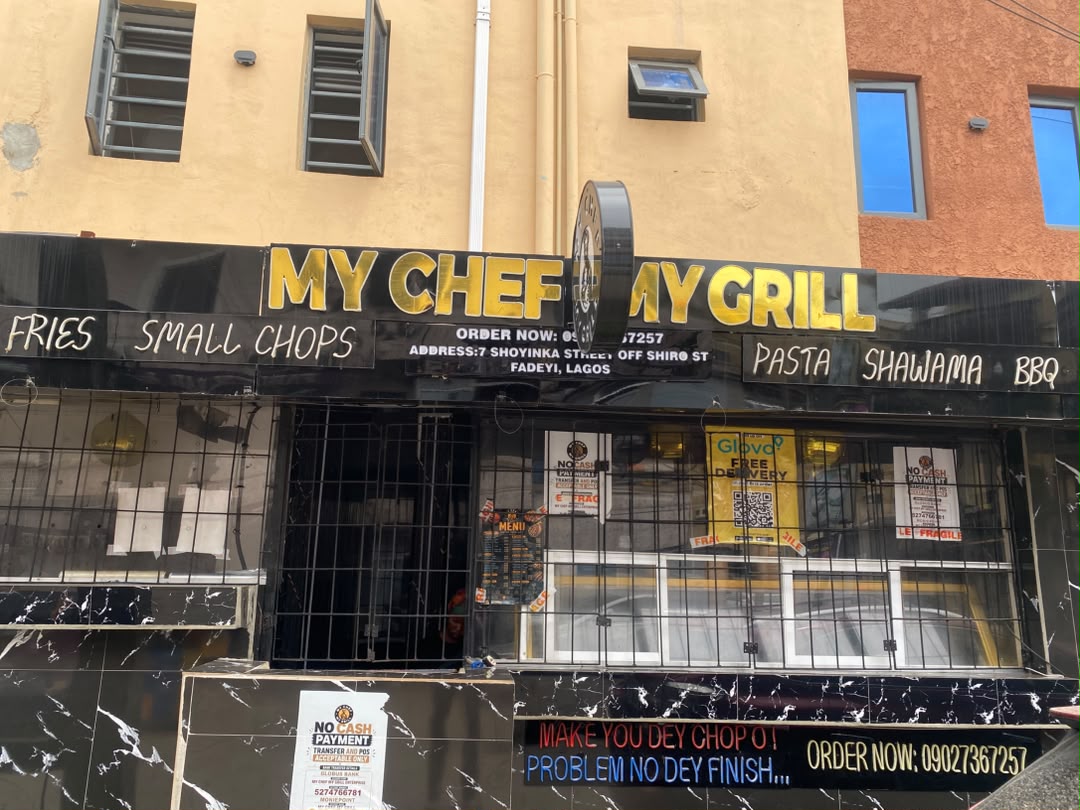 Original daytime photo of My Chef My Grill's black-and-gold frontage, with cream and terracotta walls above