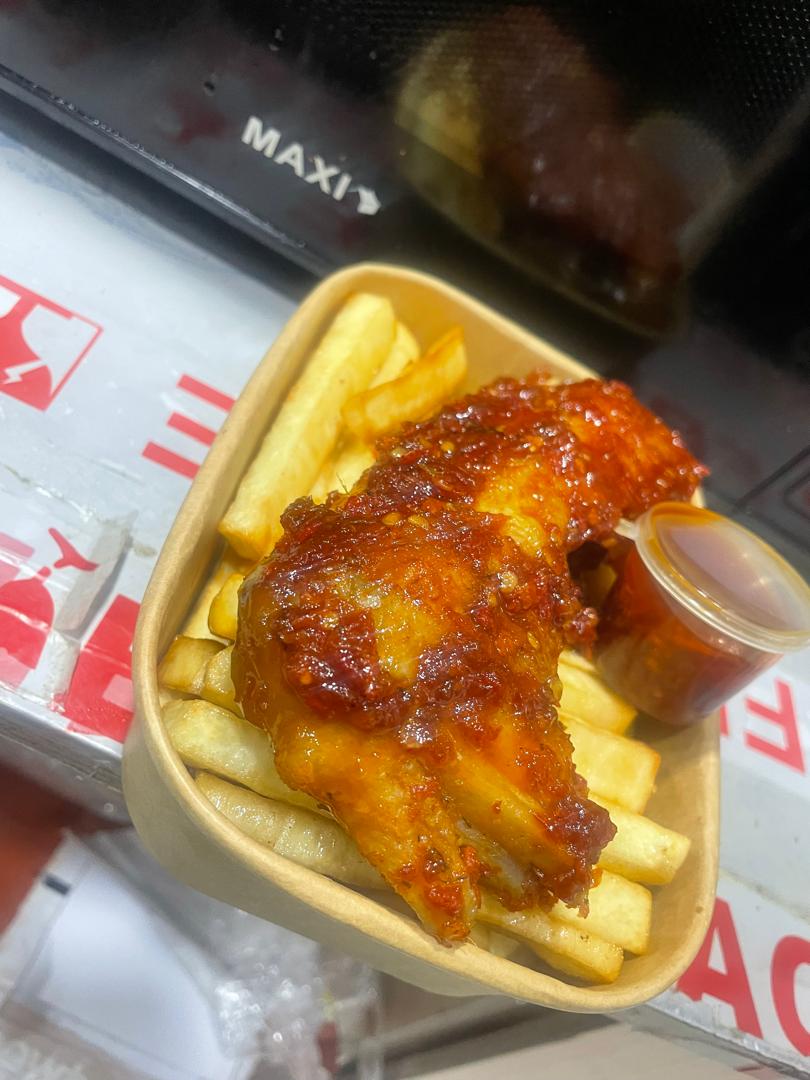 French Fries with Chicken in a takeaway tray, photographed at My Chef My Grill
