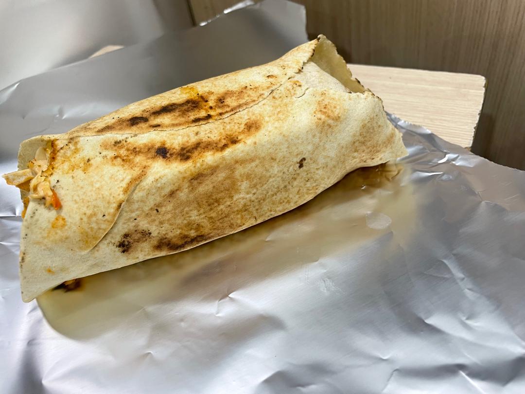 Wrapped chicken shawarma: the presentation shared by our regular chicken, sausage, cheese, and extra-chicken options