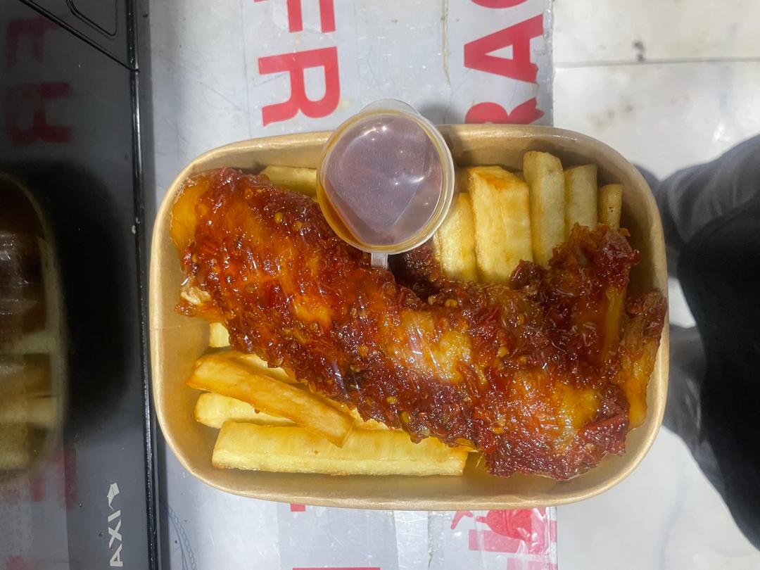 Yam Fries with Chicken and a sauce cup in a takeaway tray, photographed at My Chef My Grill
